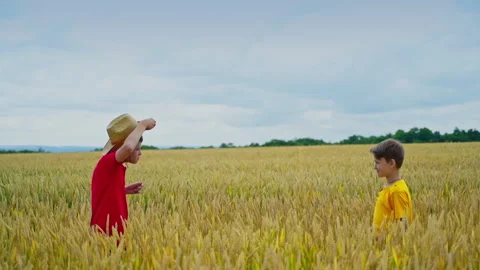 Children playing on field Stock Footage 135985926