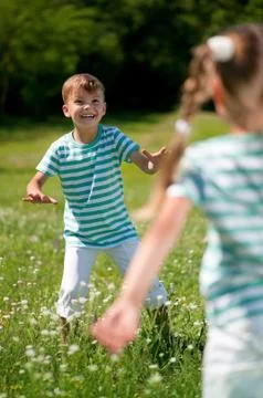 Children playing flying disk Stock Photos