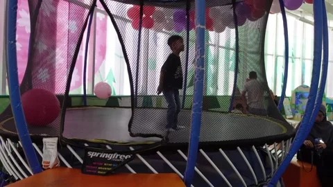 Children playing happily on the trampoline Stock Footage 314270000