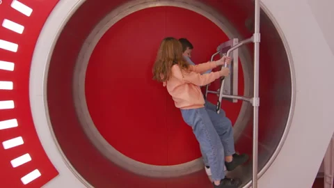Children playing heart-rating simulator in science and medical museum Stock Footage 233492717