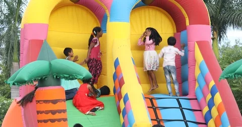 Children Playing On Inflatable Slide Stock Footage 112935245