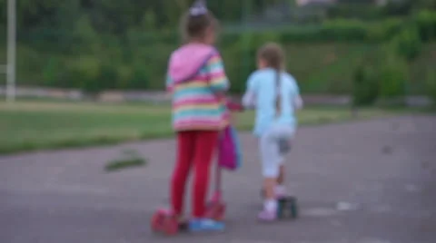 Children playing kick scooter Stock Footage 67385663