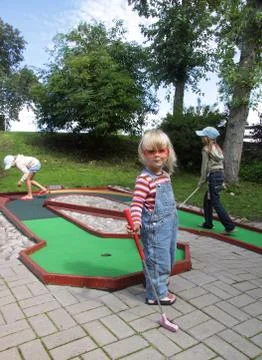 Children playing mini golf Stock Photos