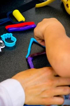 Children playing with modeling clay Stock Photos