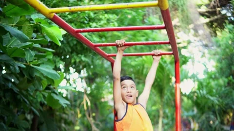 Children playing on monkey bars in a playground Video stock 312691048