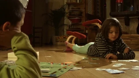 Children playing monopoly Stock Footage 71193457