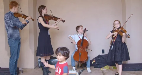 Children Playing Music with Dancer Stock Footage 115284480