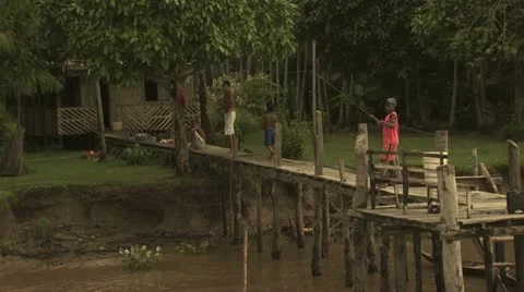 Children Playing on A Pier on The Amazon River Video stock 19036524