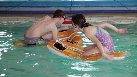 Children playing in pool Stock-Footage 91893974