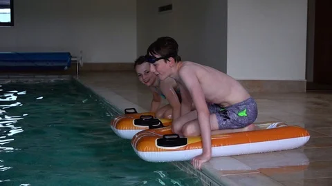 Children playing in pool Stock Footage 91898323