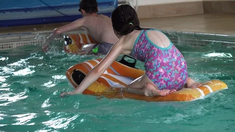 Children playing in pool Stock Footage 91899538