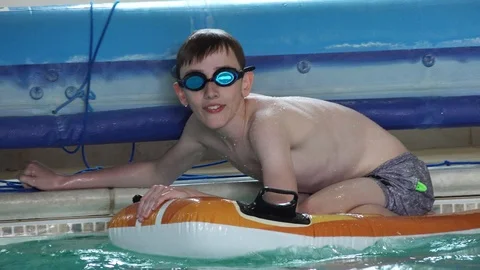 Children playing in pool Stock Footage 91899655