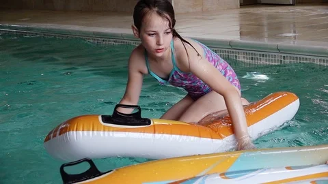Children playing in pool Stock Footage 91900042