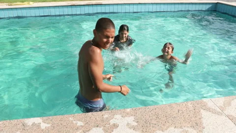 Children playing in the pool Stock Footage 134742371