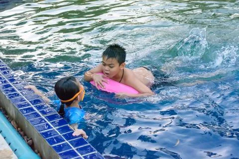 Children playing in the pool Stock Photos