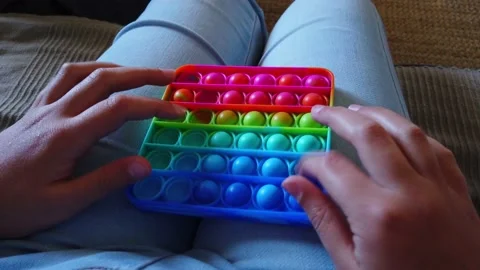 Children playing with the Pop It fidget. Stock Footage 155452351