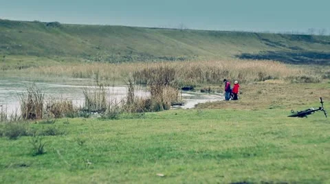 Children playing on the river Stock Footage 10588303