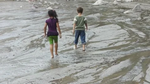 Children playing in a river Stock Footage 11633389