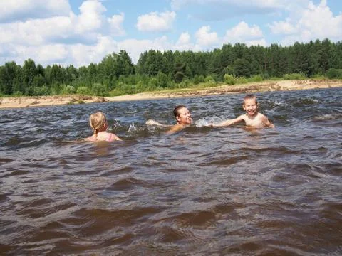 Children playing in the river Stock Photos
