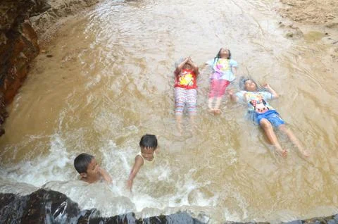 Children playing on the river Stock Photos