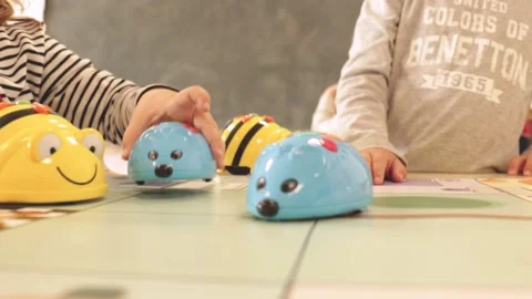 Children playing with robots to learn Stock Footage 164324773