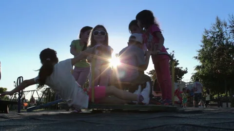 Children Playing On A Roundabout at the sunset time Vidéo 50648236