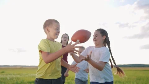 children playing rugby in the park. a gr... | Stock Video | Pond5