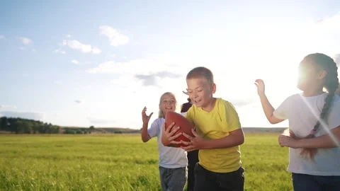 children playing rugby in the park. a gr... | Stock Video | Pond5