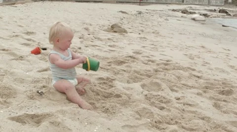 Children playing in the sand on the beach 2.mov Stock Footage 59100464