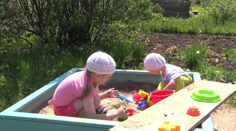 Children playing in the sandbox Stock Footage 39959196
