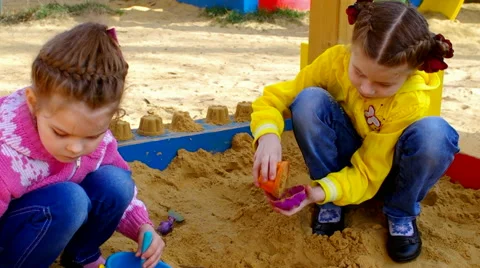 Children playing in the sandbox Stock Footage 62321195