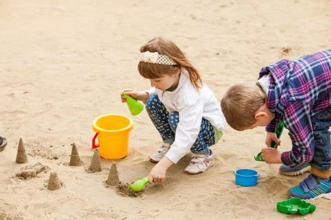Children playing in a sandbox Stock Photos
