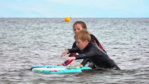 Children playing in the sea Stock Footage 93067363
