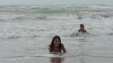 Children playing in the sea Stock Footage 139403120