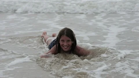 Children playing in the sea Stock Footage 139403127