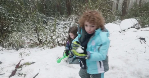 Children playing in the snow and throwing snowballs Stock-Footage 99467143