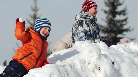 Children playing in the snow Stock Footage 35911097