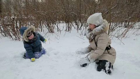 Children playing in the snow Stock Footage 73357373