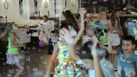 Children playing with soap bubbles Stock Footage 68177674