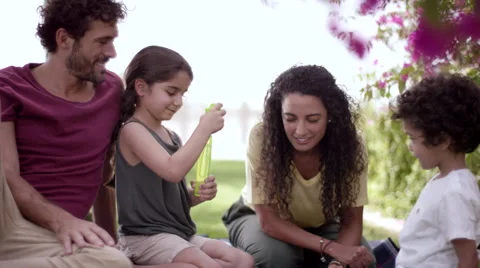 Children playing with soap bubbles at park. Stock Footage 63510491
