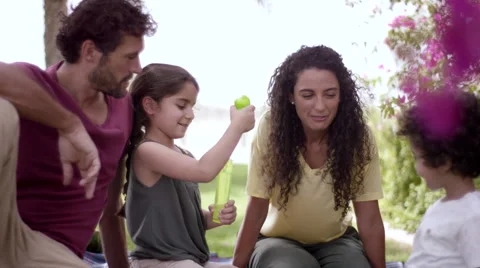 Children playing with soap bubbles at park. Stock Footage 63510758