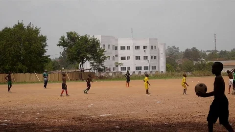 Children playing soccer in town Video stock 80576395