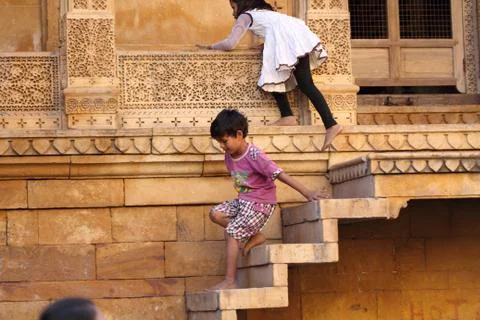 Children playing on stone steps Stock Photos