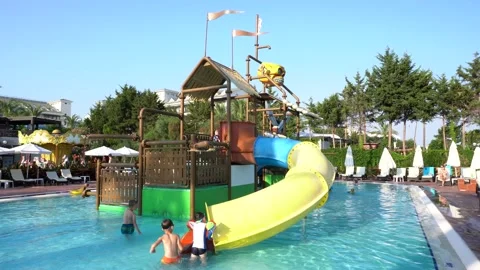 Children playing at swimming pool Stock Footage 157448974