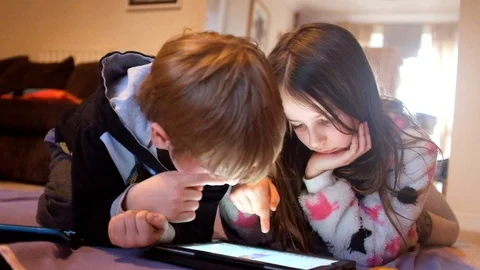 Children playing with tablet Stock Footage 88438637