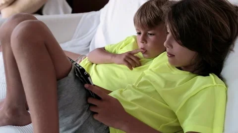 Children playing with a a tablet Stock Footage 138429937