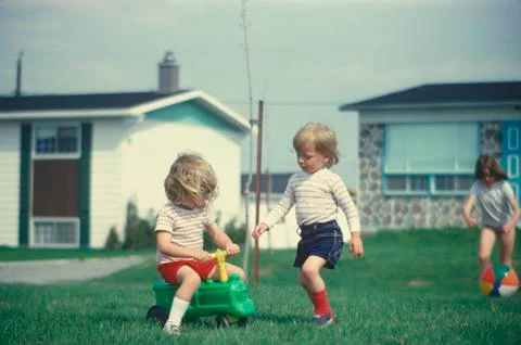Children playing in their front yard Stock Photos