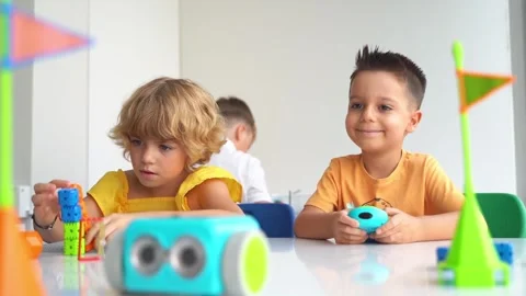 Children playing with toy car control panel in STEM educational class Stock Footage 255076485