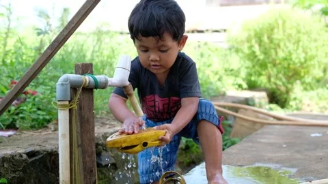Children playing in the water  Stock Footage 244214083