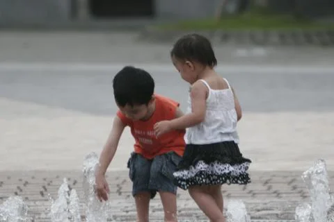 Children Playing in Water Stock Photos